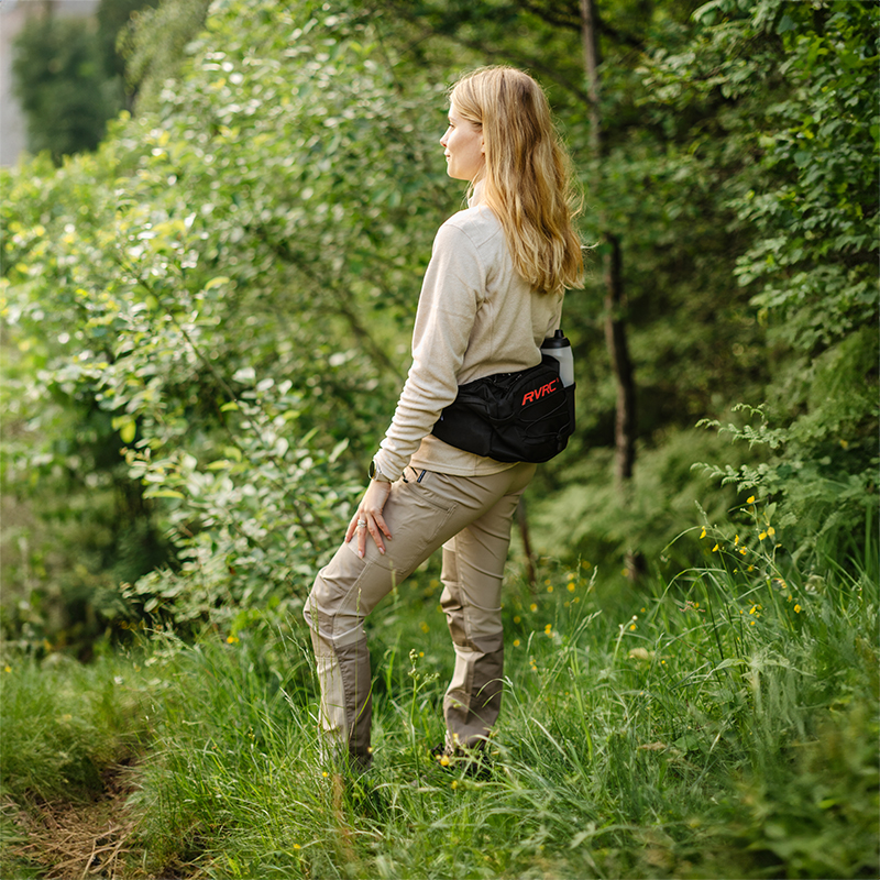 Trek hip bag fashion shown in Earth woven/cognac